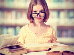 Funny Girl Student With Glasses Reading Books