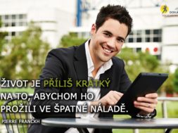 Young successful businessman with tablet outdoors